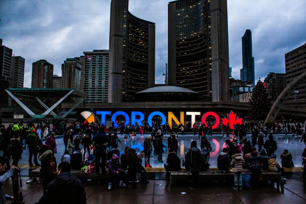 People Gathered in Front of Toronto Freestanding Signage, Canada, MICE Travel, Gateway to Toronto, 